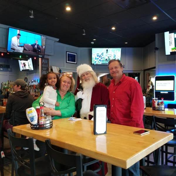 Family with Santa in restaurant