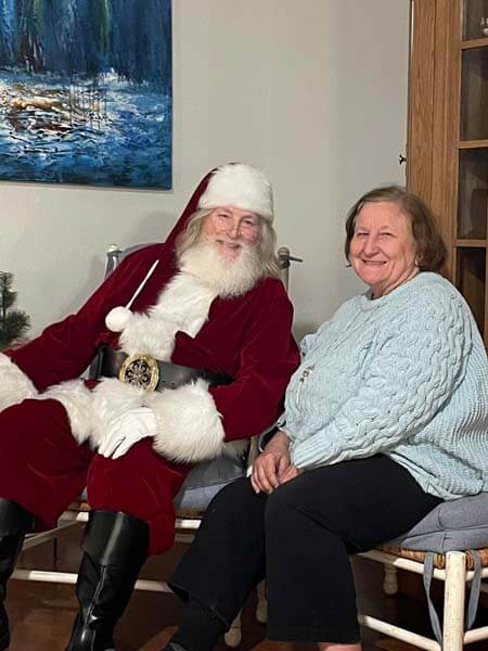 Elderly woman with Santa