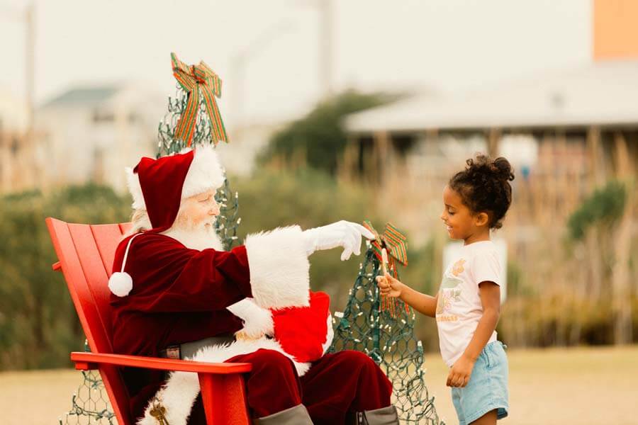 Santa on beach with child