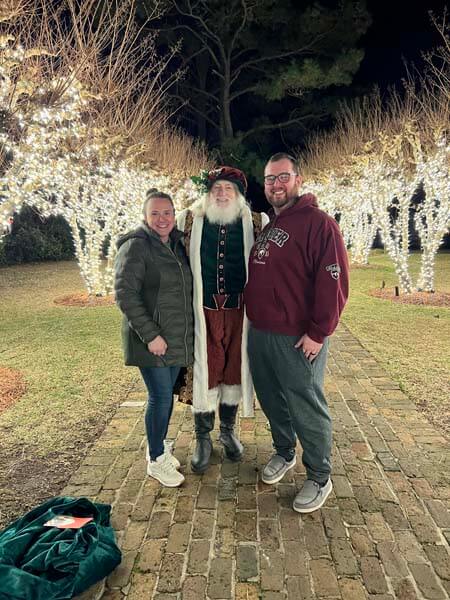 Santa with couple outdoors
