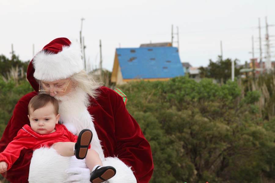 Santa outdoors with child