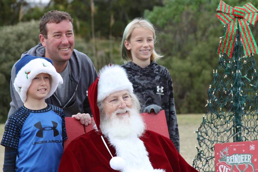 Family outdoors with Santa