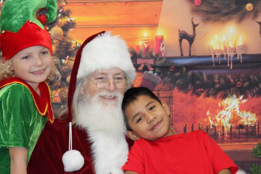 Santa posing with children