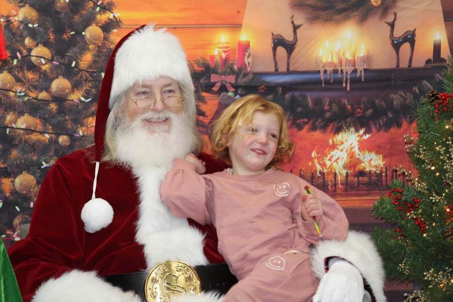 Child sitting on Santa's lap