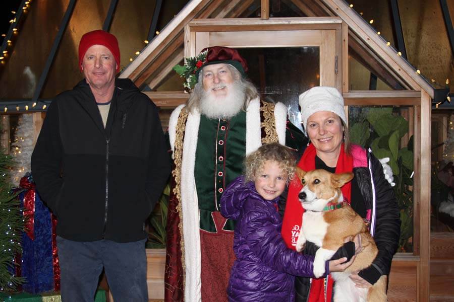 Family and dog with Santa