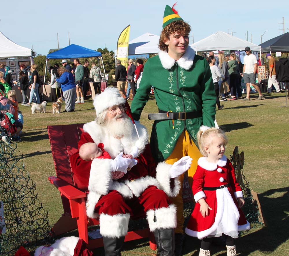 Santa and elf with child