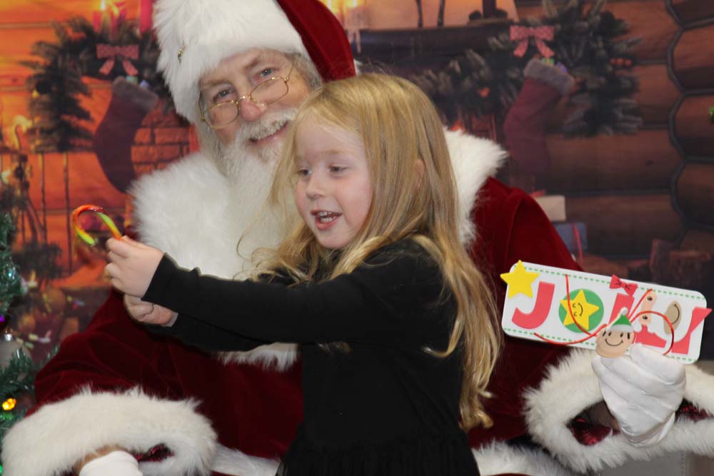 Santa sitting with child